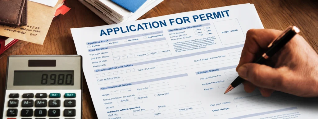 Development application documents and permit forms on desk — DA approval paperwork